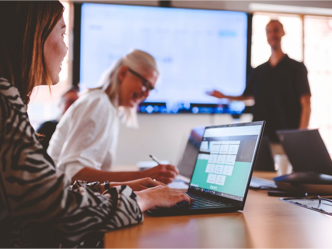 Person taking notes during a presentation