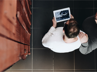 People looking at a tablet